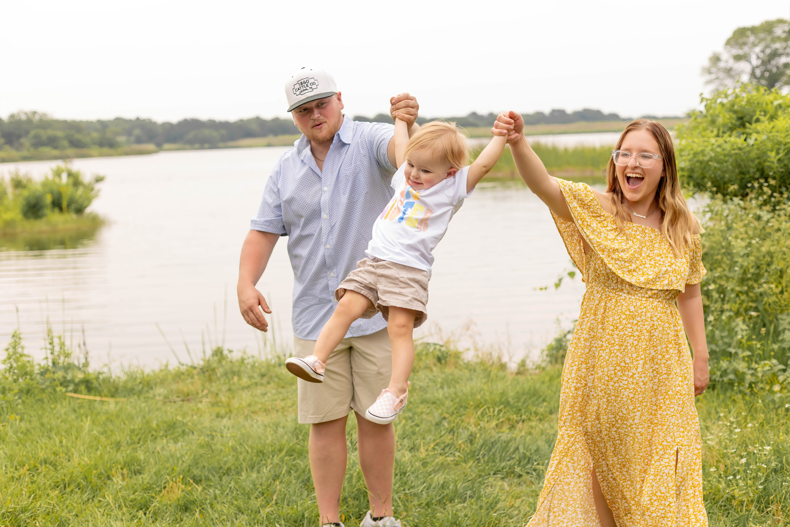 I had the pleasure of doing a maternity announcement session at a hidden part of the Black Creek Lake, nestled near the serene pine forest of the LBJ State Park. The quiet picturesque location provided the perfect backdrop